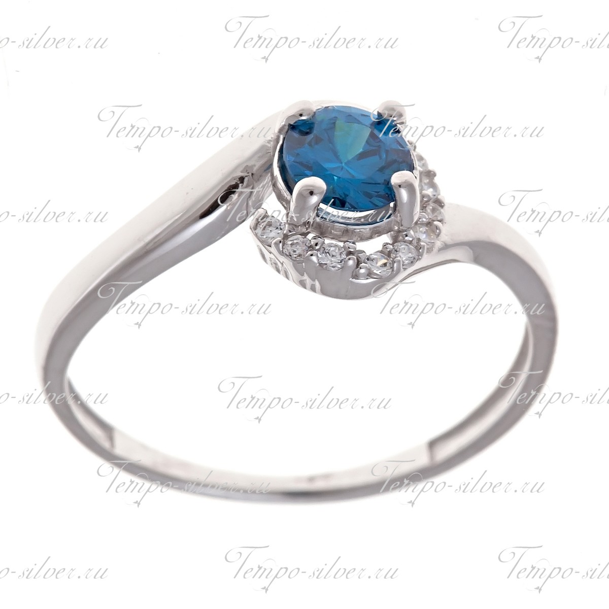 Кольцо из серебра с круглым голубым камнем на декоративной верхушке