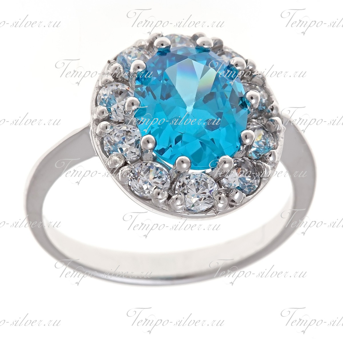 Кольцо из серебра круглой формы с голубым камнем, окруженный белыми куб.циркониями цена