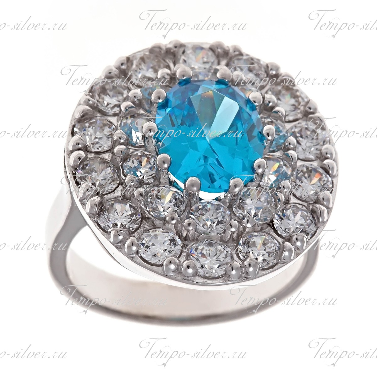 Кольцо из серебра с овальным голубым камнем в центре россыпи из белых камней