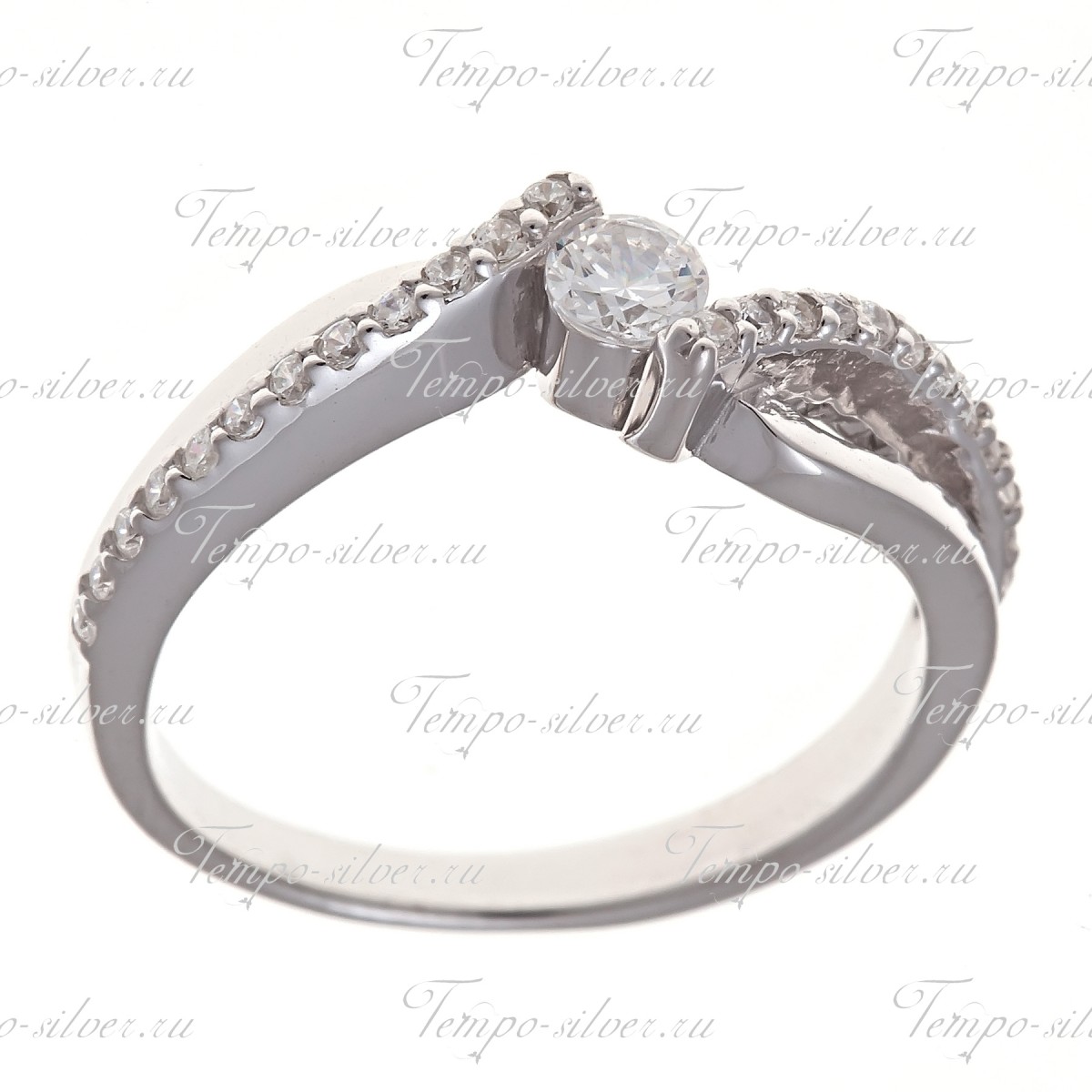 Кольцо из серебра на тонкой волнообразной шинке с белыми камнями цена